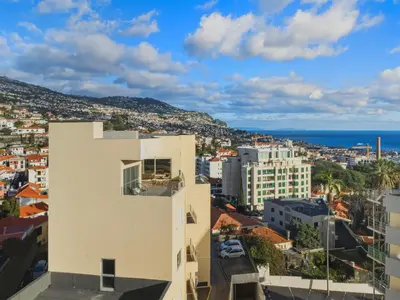 a view of the city from a building at Little Paradise - Funchal in Funchal