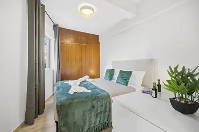a bedroom with a bed with a towel on it at Little Paradise - Funchal in Funchal