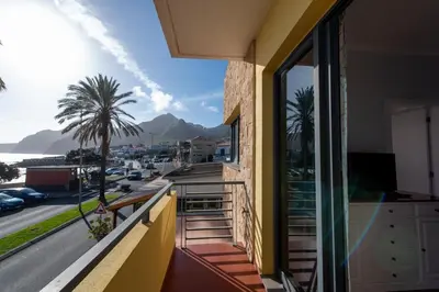 a balcony of a building with a view of a street at Apartamentos Amarelo in Caniçal