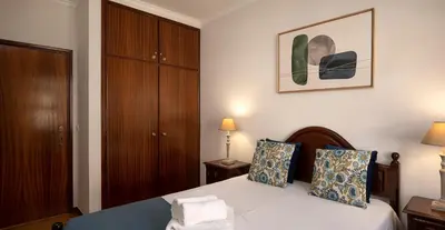 a bedroom with a bed with two pillows at Solful at the Nomads Village Ponta do Sol in Ponta do Sol
