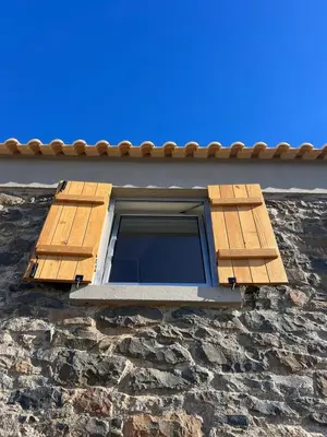 a window on the side of a stone building at Casa das Vacas - Retreat House in Ponta do Pargo