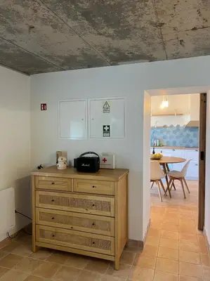 a kitchen with a wooden dresser and a dining room at Casa das Vacas - Retreat House in Ponta do Pargo