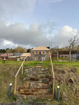 a set of stone steps leading to a house at Casa das Vacas - Retreat House in Ponta do Pargo