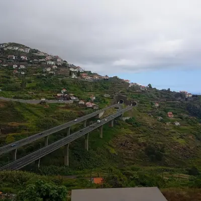 a bridge on the side of a hill with houses at Yellow Owl II Bedroom II in Campanário