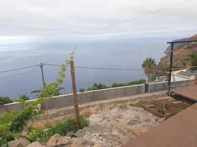 a view of the ocean from a house at Farol views in Fajã da Ovelha