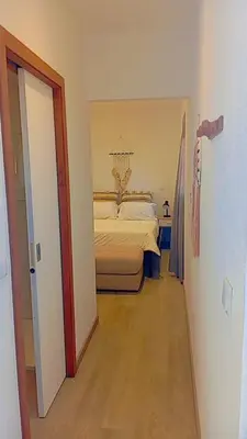 a bedroom with a bed in the middle of a room at Farol views in Fajã da Ovelha