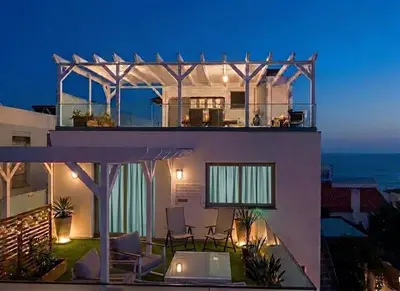 a courtyard with potted plants on a building at VILLA HELENA Pearl Apartment in Caniço