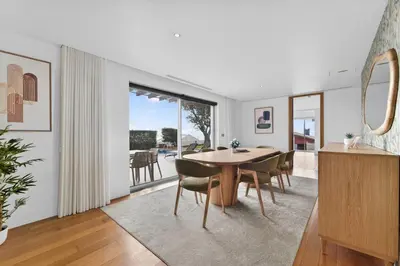 a bedroom with a bed and a desk and a window at Al Mirase Villa in Funchal