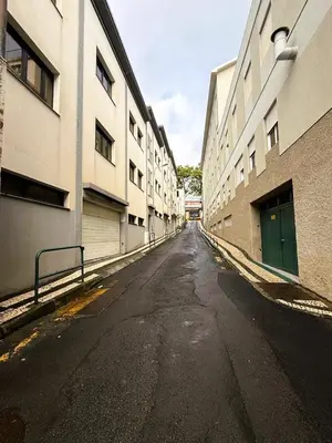 an empty street in an alley between two buildings at C Center Apartment in Funchal