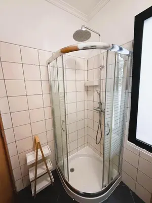 a shower with a glass door in a bathroom at C Center Apartment in Funchal