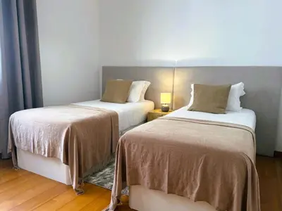 two beds in a hotel room with at C Center Apartment in Funchal
