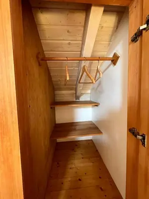 a stairway with wooden shelves in a room at Aljezur Bordeira Houses 3 bedrooms 2 bathrooms with Condo Pool in Bordeira