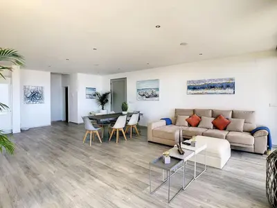 a living room with a couch and a table at New Villa Piece of Heaven by Your Madeira Rentals in Estreito da Calheta