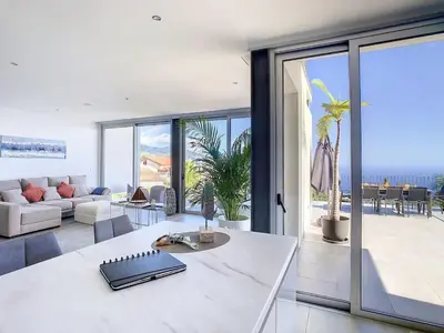 a living room with a couch and a table at New Villa Piece of Heaven by Your Madeira Rentals in Estreito da Calheta