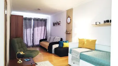 a living room with a couch and a chair at MCStylo-Vista Oceano in Caniço