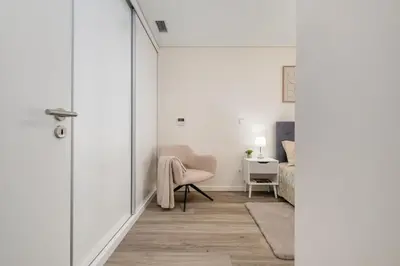 a hallway with a door leading to a bedroom at Carmo - Moon in Funchal