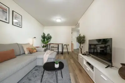 a living room with a couch and a tv at Carmo - Moon in Funchal