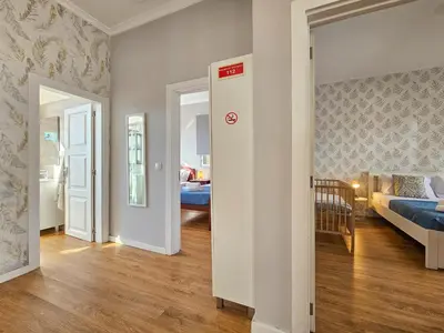 a room with a bedroom and a living room with a bed at Sunny House Funchal in Funchal