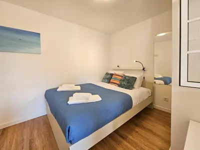 a bedroom with a bed with two towels on it at Sunny Terrace Funchal in Funchal