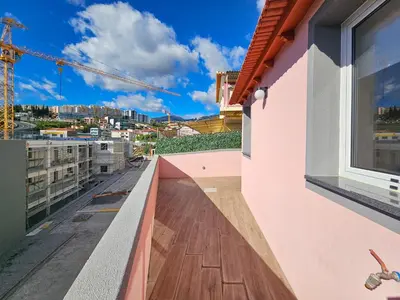 a balcony with a view of a building at Sunny Terrace Funchal in Funchal