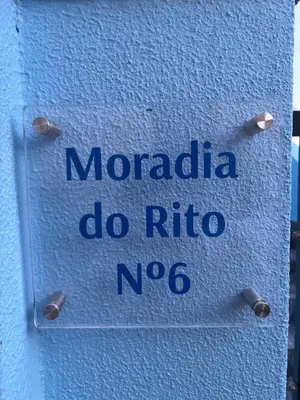 a sign that says mordida do rico noico on a wall at Sea & Mountain View Home in Machico in Machico