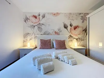 a bedroom with a white bed with two pillows at Villa Paixao by Atlantic Holiday in Machico