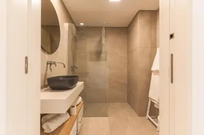 a bathroom with a sink and a shower at Horizonte Completo II by Atlantic Holiday in Câmara de Lobos