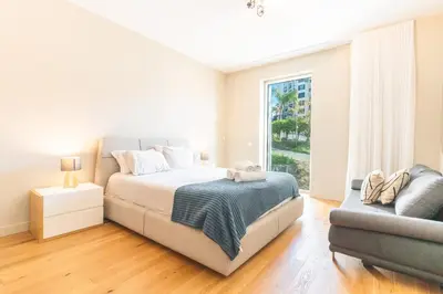 a bedroom with a bed with two towels on it at Pearl View by Atlantic Holiday in Funchal