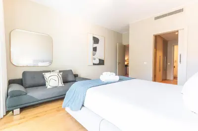 a white bathroom with a sink and a mirror at Pearl View by Atlantic Holiday in Funchal