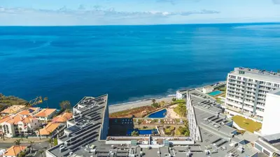 a balcony with a table and chairs and a view at Pearl View by Atlantic Holiday in Funchal