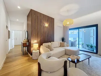 a living room with a couch and a table at Ocean Refuge by Atlantic Holiday in Funchal