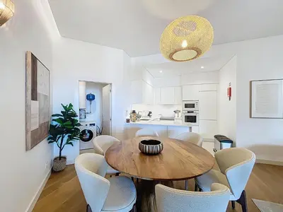 a dining room with a wooden table and chairs at Ocean Refuge by Atlantic Holiday in Funchal