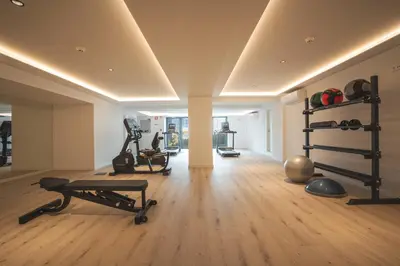 a gym with weights and exercise equipment in a room at Ocean Refuge by Atlantic Holiday in Funchal