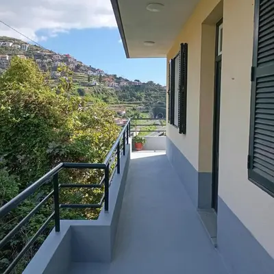 a balcony of a house with a view at Yellow Owl II Bedroom I in Campanário