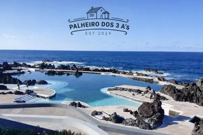 a sign for a aquarium in front of a building at Palheiro dos 3 A`s in Achadas da Cruz