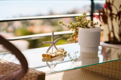 a glass table with a seashell and a starfish on it at GuestReady - Ocean breeze retreat in Santa Cruz