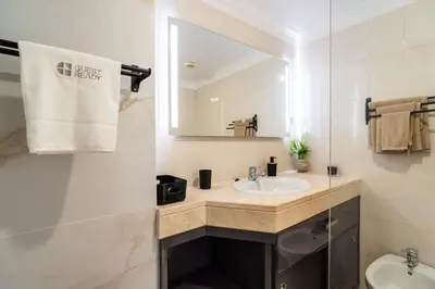 a bathroom with a sink and a mirror at GuestReady - Ocean breeze retreat in Santa Cruz