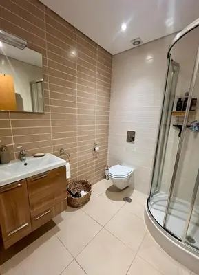 a bathroom with a toilet and a sink and a shower at Casa Solaris Algarve in Burgau