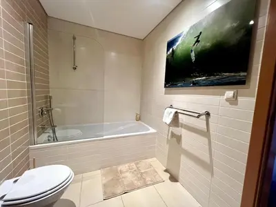 a bathroom with a toilet and a bath tub at Casa Solaris Algarve in Burgau