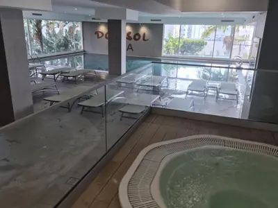 a room with a jacuzzi tub in a building at Hotel Bunganvilia in Funchal