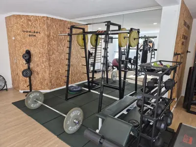 a gym with a bunch of equipment in a room at Hotel Bunganvilia in Funchal