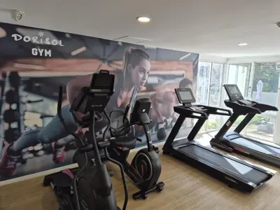 a gym with three exercise bikes in a room at Hotel Bunganvilia in Funchal