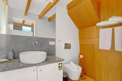 a bathroom with a sink and a toilet at Romantic Retreat by Slice of Heaven in Jardim do Mar