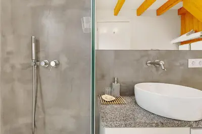 a bathroom with a sink and a shower at Romantic Retreat by Slice of Heaven in Jardim do Mar