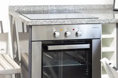 a kitchen counter with a coffee maker and a blender at Villa Lobos Flat 1 in Câmara de Lobos