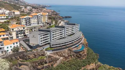 a building on a cliff next to the ocean at Xavelha Clifftop by Atlantic Holiday in Câmara de Lobos