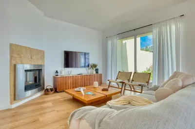 a living room with a couch and a table at Skyline Villa by Holiday Rental Madeira in Gaula