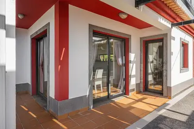 a facade of a building with glass doors on it at New Casa Bondi by Your Madeira Rentals in Ponta do Sol