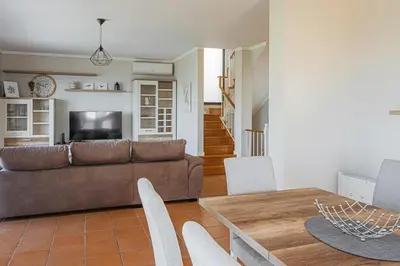 a living room with a couch and a table at New Casa Bondi by Your Madeira Rentals in Ponta do Sol