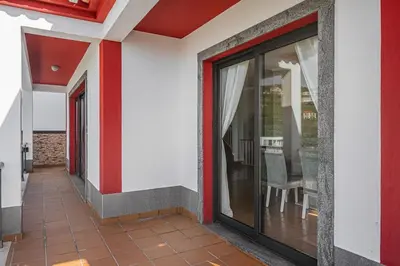 a corridor of a house with sliding glass doors at New Casa Bondi by Your Madeira Rentals in Ponta do Sol